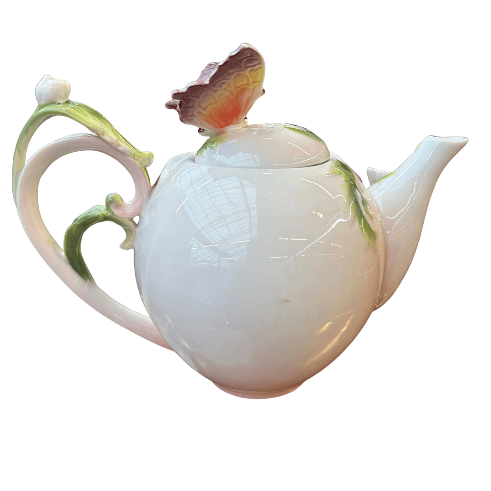 Theepot met vlinder