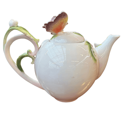 Theepot met vlinder